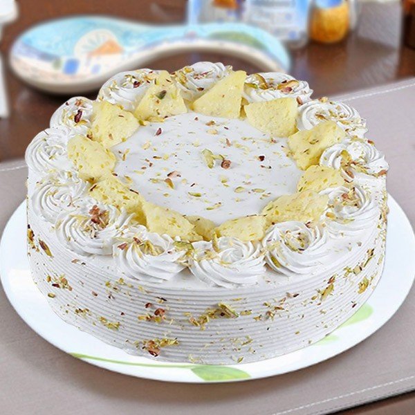 Send ras malai cake with rose on top online by GiftJaipur in Rajasthan